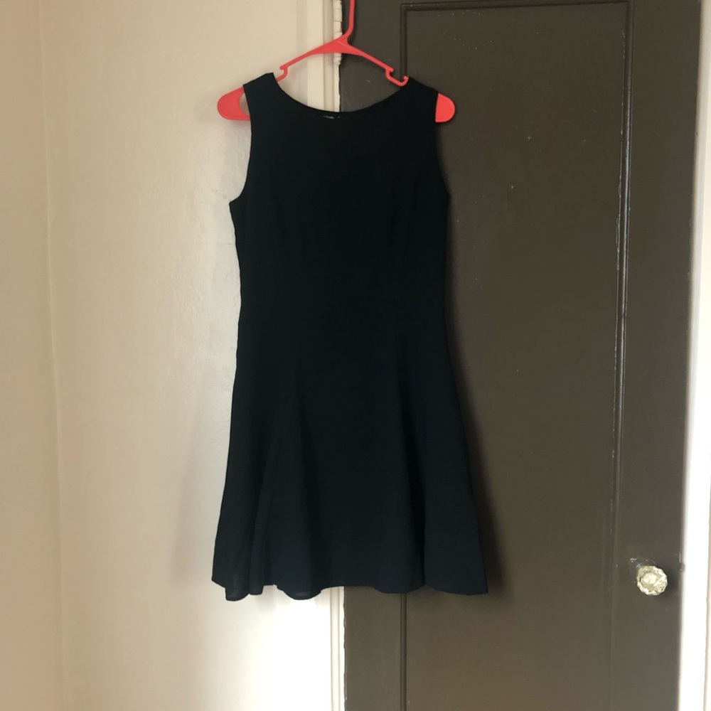 Carole little vintage black dress, size 12, knit like design, was thrifted.
